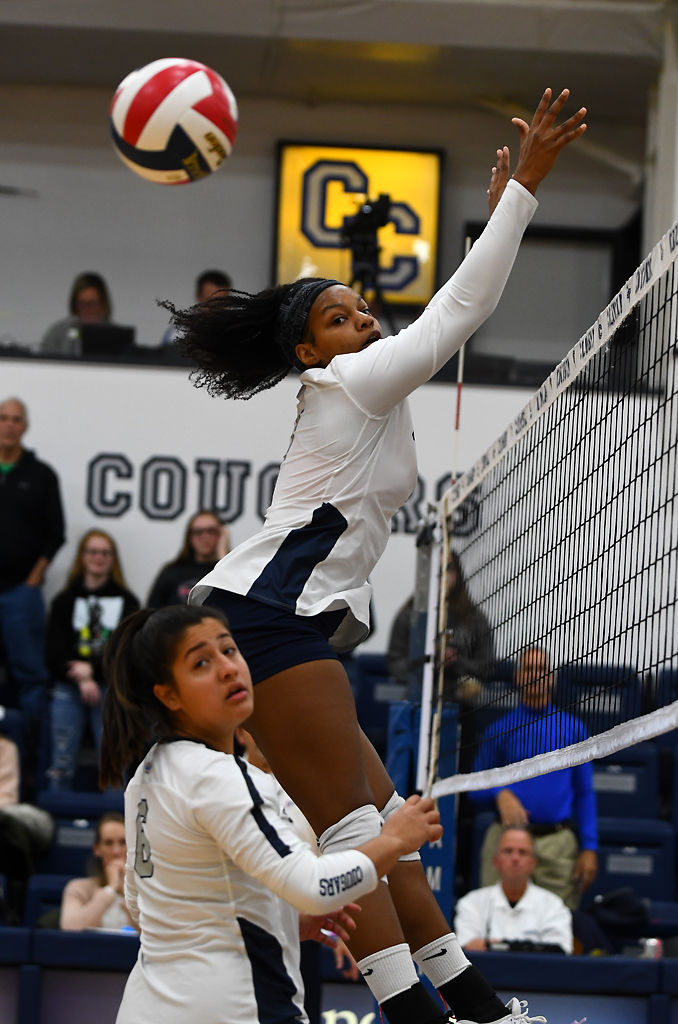Columbia College player Aaliyah Durant jumps to block a hit